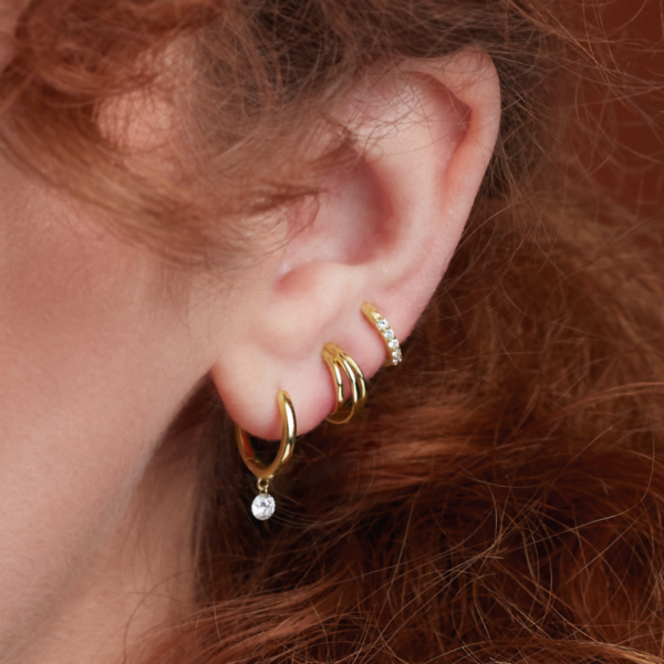 Multi Layer Hoop Earrings in 14K yellow Gold on earlobe